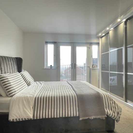 Storm grey sliding wardrobes in Sheffield by James Kilner