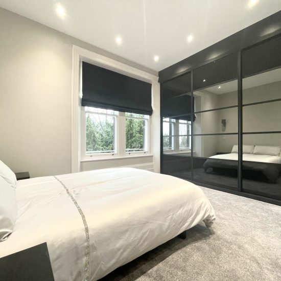 5 Panel black and mirror bespoke sliding wardrobes fitted in Sheffield by James Kilner