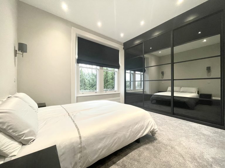 5 Panel black and mirror bespoke sliding wardrobes fitted in Sheffield by James Kilner